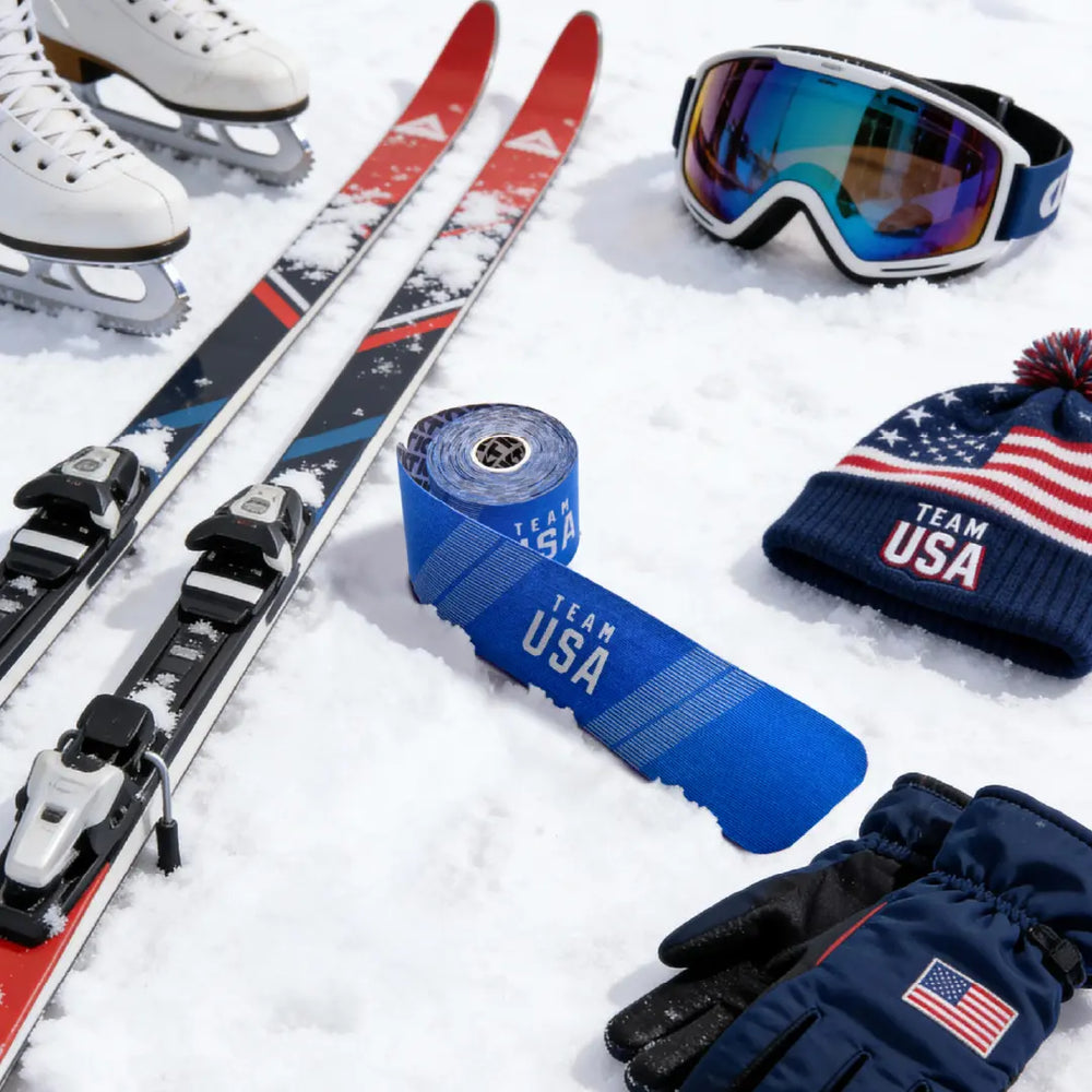 Ski equipment and KT Tape with Team USA branding on a snowy background