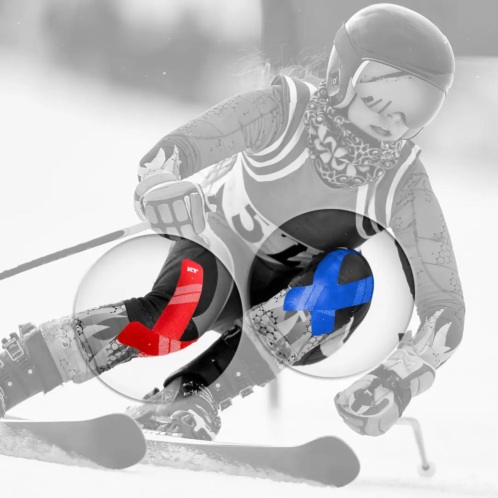 Person in a snowmobile suit with a close-up of gloves on a gray background
