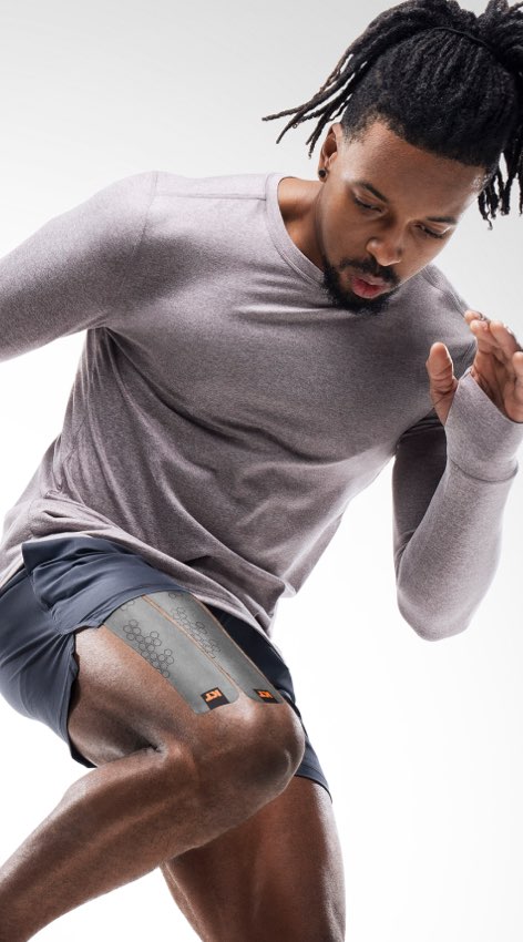 Man exercising with KT Tape Pro Oxygen applied to leg